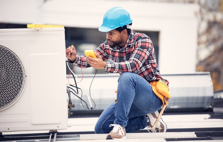 commercial hvac technician testing unit