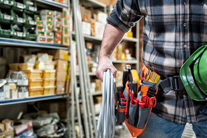 handyman getting supplies in a hardware store