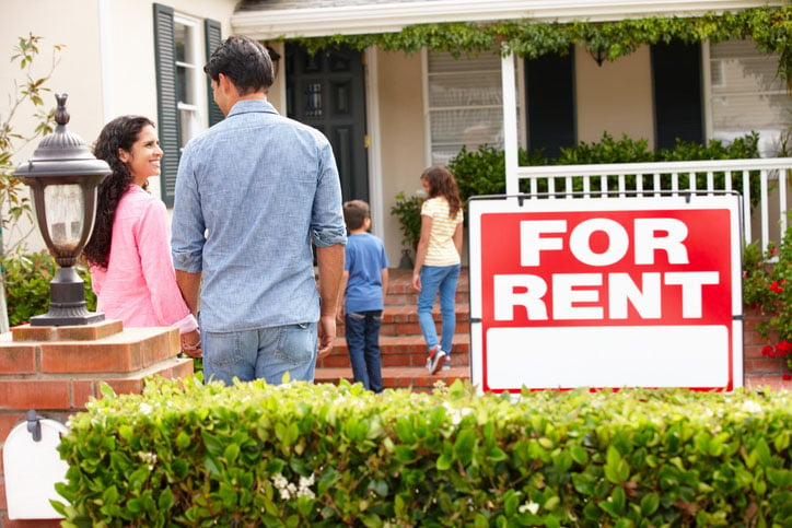 happy family enters rental home