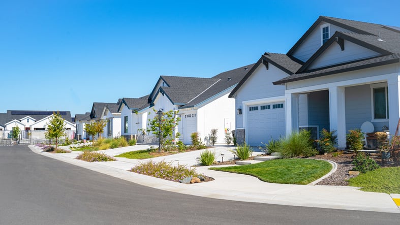 row of single family homes in suburban neighborhood